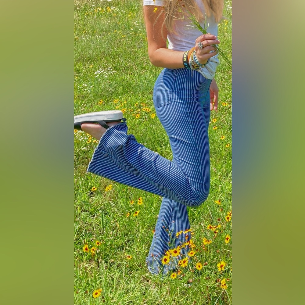 ALTAR’D STATE ⭐️ 🫐 Blue flare jeans with white pinstripes.